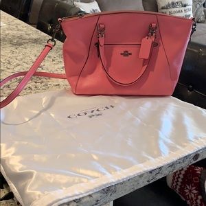 Coach pink handbag with original storage bag.